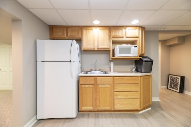 6615 Pleasantview Dr, Portage, MI 49024 - kitchen featuring white appliances, a paneled ceiling, light countertops, light wood-style floors, and recessed lighting