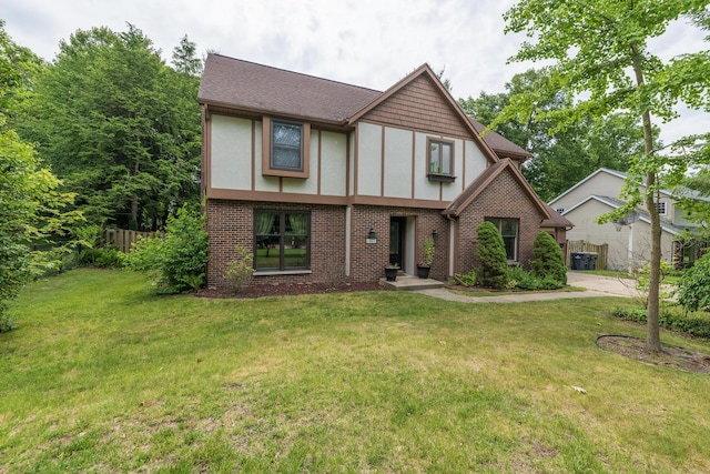 6615 Pleasantview Dr, Portage, MI 49024 - tudor-style house featuring brick siding