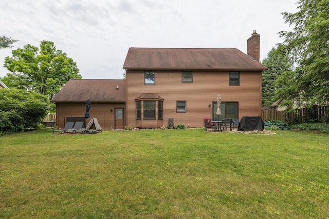 6615 Pleasantview Dr, Portage, MI 49024 - back of property with a chimney