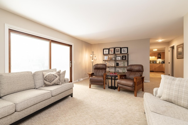 6615 Pleasantview Dr, Portage, MI 49024 - living room featuring baseboards and light carpet