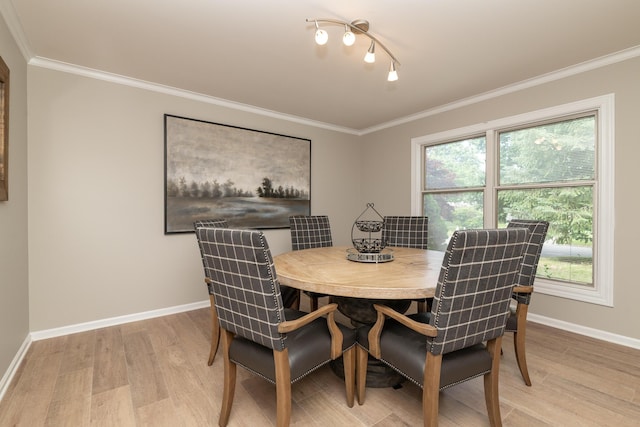 6615 Pleasantview Dr, Portage, MI 49024 - dining room featuring light wood-style flooring, plenty of natural light, and crown molding