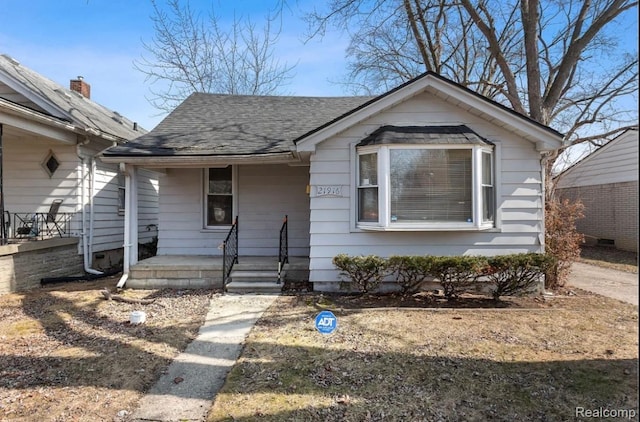 21916 Oakwood Ave, Washington, MI 48021 - bungalow with a porch and a shingled roof