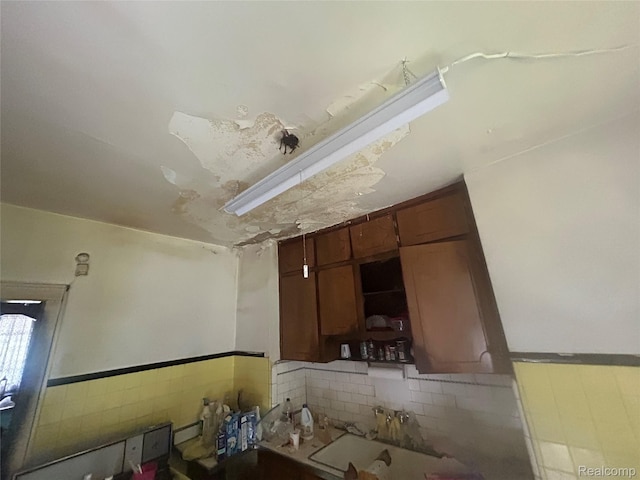18602 Brinker St, Detroit, MI 48234 - bathroom featuring a sink and a wainscoted wall