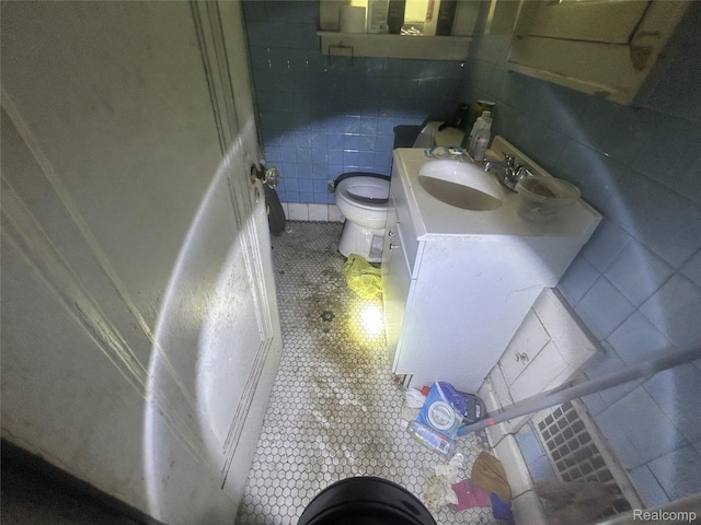 18602 Brinker St, Detroit, MI 48234 - half bath with tile patterned floors, vanity, and tile walls