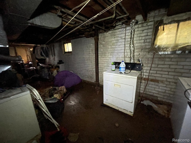 18602 Brinker St, Detroit, MI 48234 - basement with washer and clothes dryer and brick wall