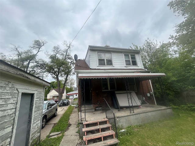 18602 Brinker St, Detroit, MI 48234 - view of front facade featuring covered porch