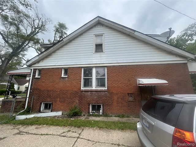 18602 Brinker St, Detroit, MI 48234 - view of home's exterior featuring brick siding