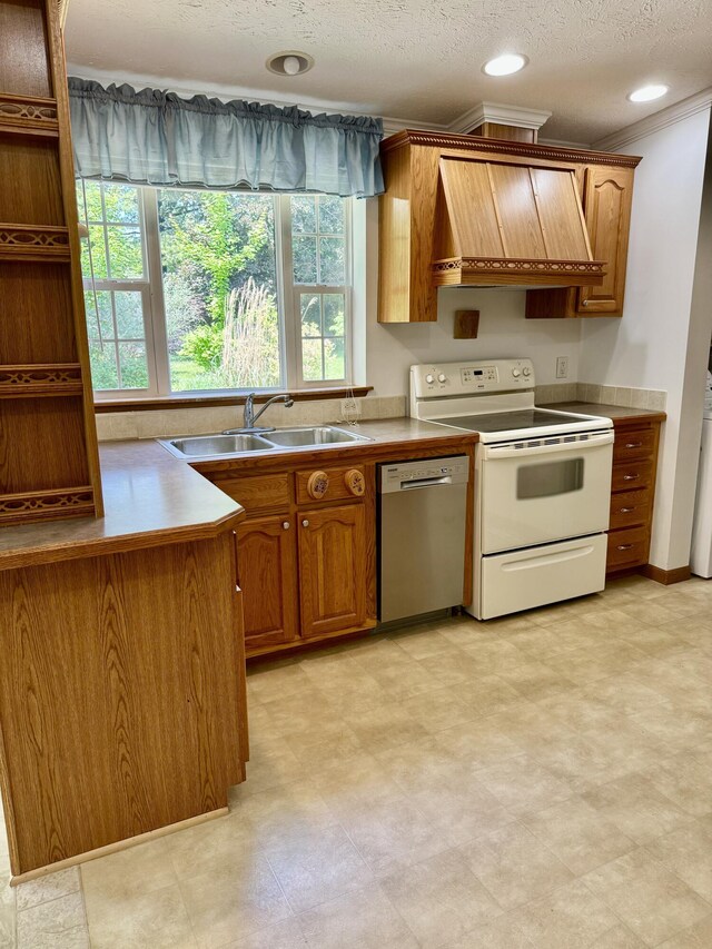 8484 Zosel St, Onekama, MI 49675 - kitchen featuring custom exhaust hood, white electric range, dishwasher, brown cabinetry, and a textured ceiling