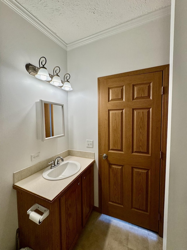 8484 Zosel St, Onekama, MI 49675 - bathroom with vanity, crown molding, and a textured ceiling