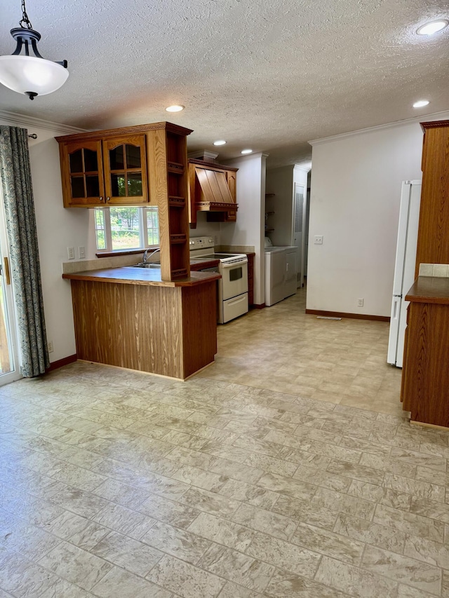 8484 Zosel St, Onekama, MI 49675 - kitchen with white appliances, a peninsula, glass insert cabinets, recessed lighting, and washing machine and clothes dryer