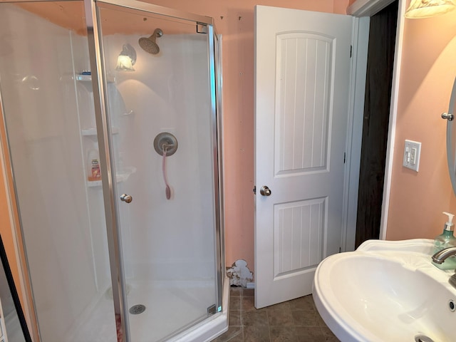 715 Filer Ave, Filer City, MI 49634 - full bathroom featuring a shower stall and tile patterned floors