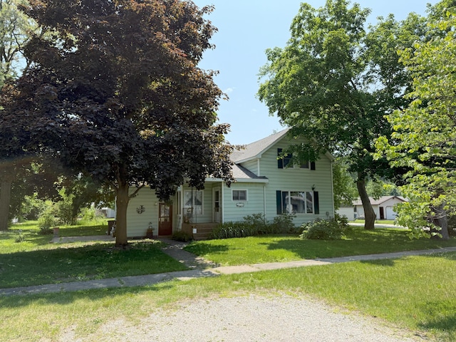 715 Filer Ave, Filer City, MI 49634 - view of property hidden behind natural elements featuring a front yard