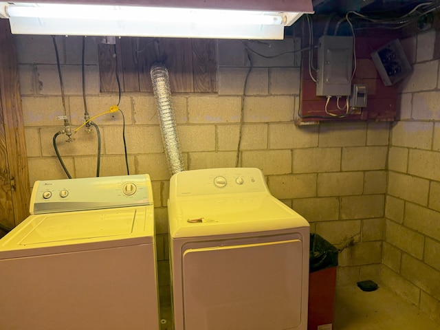 715 Filer Ave, Filer City, MI 49634 - laundry room featuring washer and dryer and concrete block wall