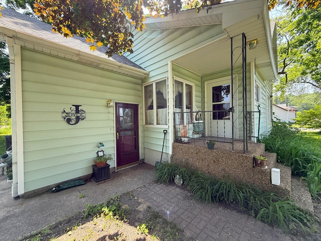 715 Filer Ave, Filer City, MI 49634 - property entrance featuring roof with shingles