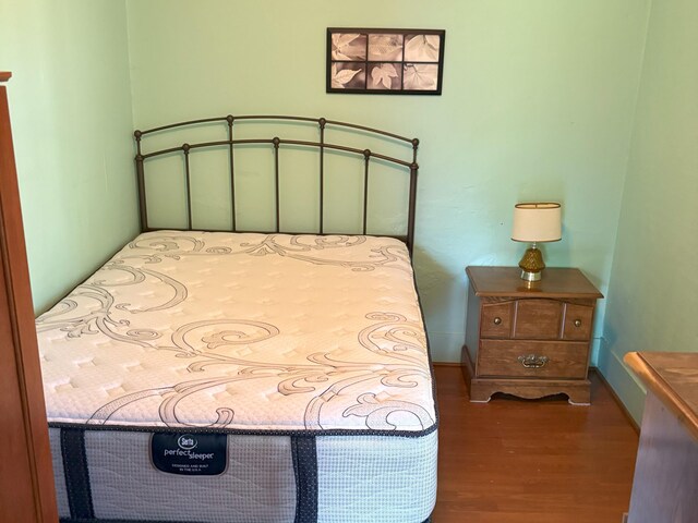 715 Filer Ave, Filer City, MI 49634 - bedroom featuring wood finished floors