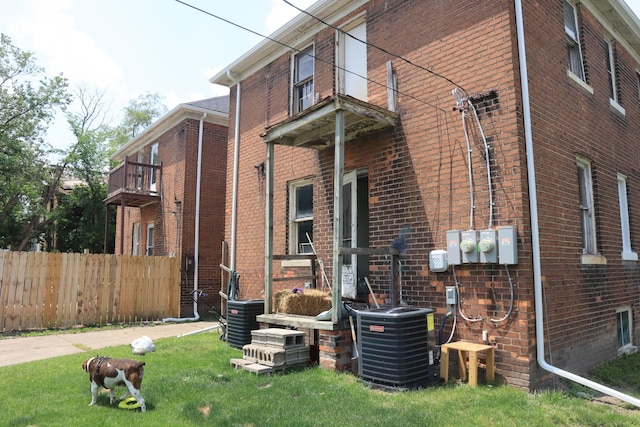 5523 Oregon St, Detroit, MI 48204 - view of side of home with a central air condition unit and brick siding
