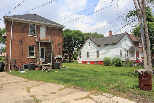 5523 Oregon St, Detroit, MI 48204 - back of house with brick siding and a lawn