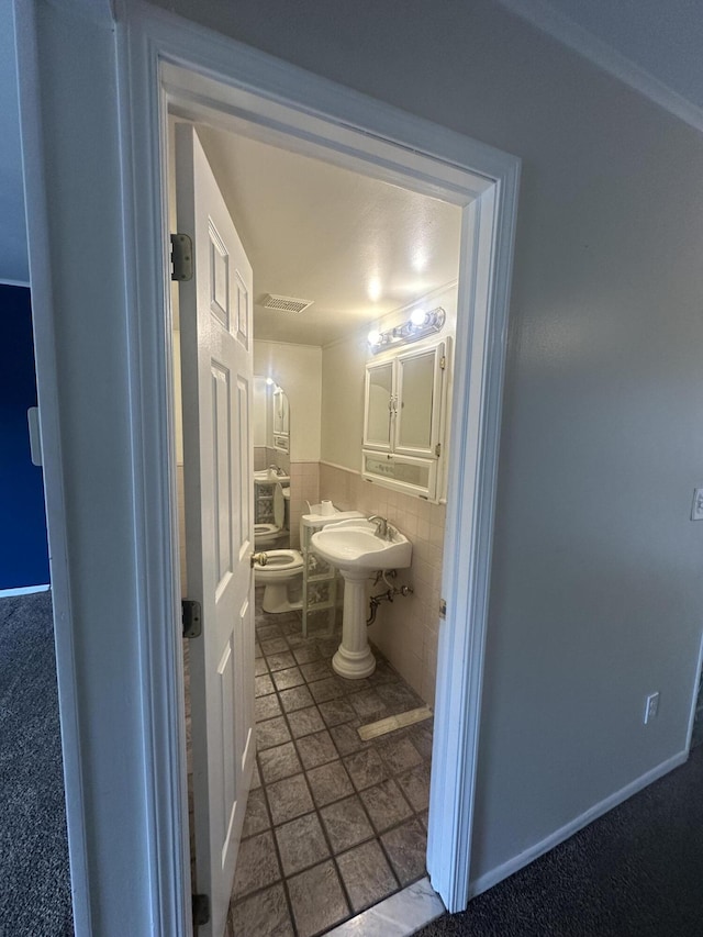 3002 Seaton Circuit N, Warren, MI 48091 - half bath with a wainscoted wall, tile walls, and stone finish flooring