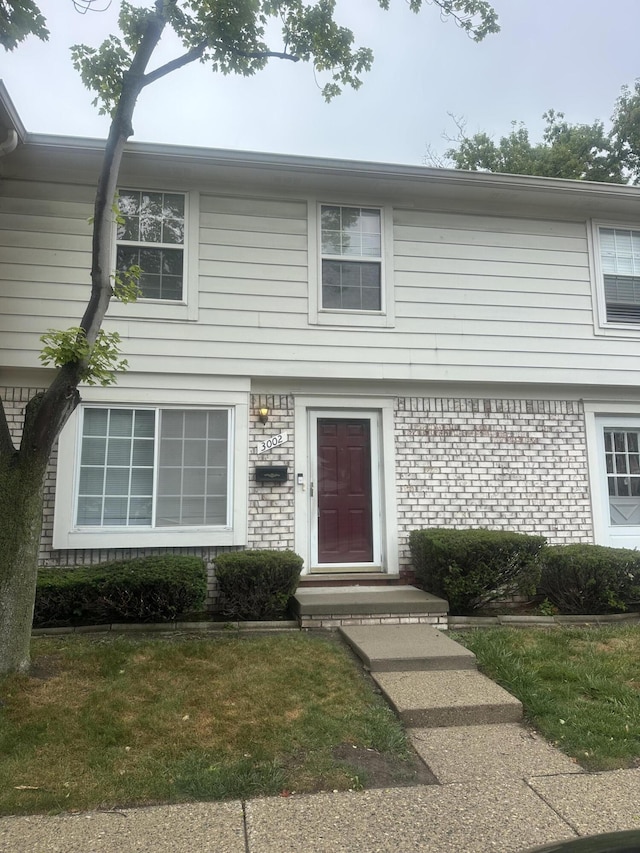 3002 Seaton Circuit N, Warren, MI 48091 - colonial inspired home with brick siding and a front lawn