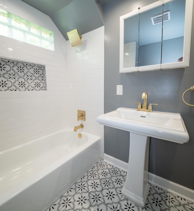 2712 Voorheis Rd, Waterford, MI 48328 - bathroom with shower / tub combination, tile patterned floors, and lofted ceiling