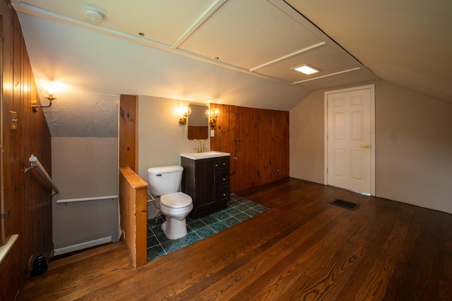 2712 Voorheis Rd, Waterford, MI 48328 - bathroom with wood finished floors, vanity, and vaulted ceiling
