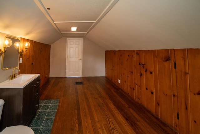 2712 Voorheis Rd, Waterford, MI 48328 - bathroom with wood finished floors, wood walls, vanity, and lofted ceiling