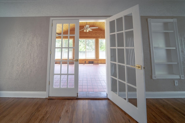 2712 Voorheis Rd, Waterford, MI 48328 - doorway with a textured wall, wood finished floors, built in features, vaulted ceiling, and ceiling fan