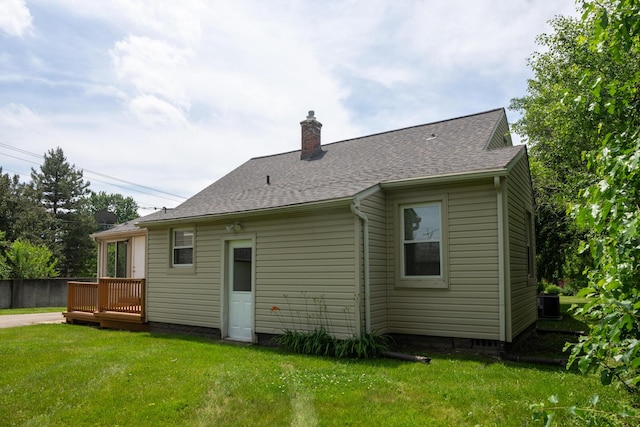 2712 Voorheis Rd, Waterford, MI 48328 - rear view of house with a chimney, roof with shingles, and a wooden deck