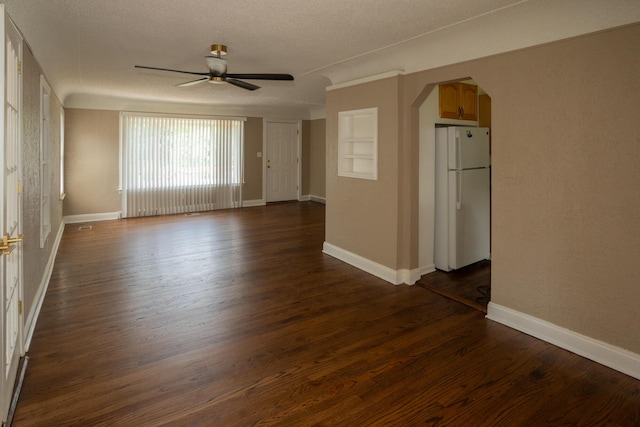 2712 Voorheis Rd, Waterford, MI 48328 - unfurnished room with a ceiling fan, arched walkways, and dark wood-style floors