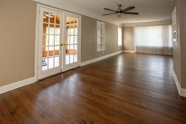 2712 Voorheis Rd, Waterford, MI 48328 - empty room with ceiling fan, healthy amount of natural light, built in shelves, dark wood-style flooring, and a textured wall