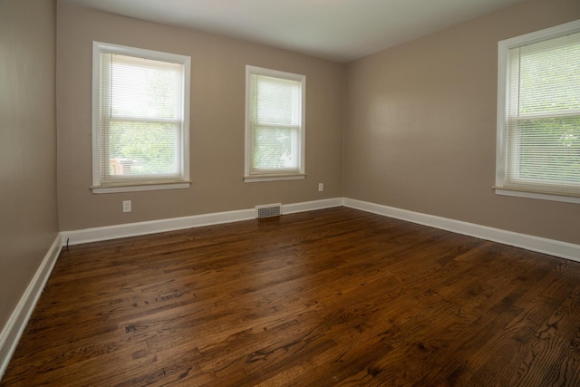 2712 Voorheis Rd, Waterford, MI 48328 - empty room with dark wood-style flooring and baseboards