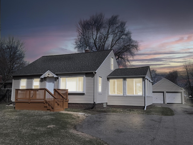 2712 Voorheis Rd, Waterford, MI 48328 - view of front of house featuring an outdoor structure, roof with shingles, a detached garage, and a chimney