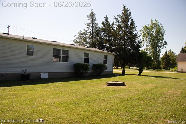 5022 Belsay Rd, Grand Blanc, MI 48439 - view of green lawn featuring a fire pit
