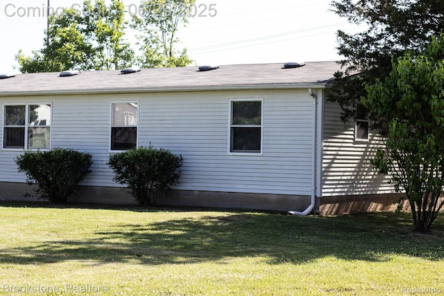 5022 Belsay Rd, Grand Blanc, MI 48439 - view of side of property with a lawn