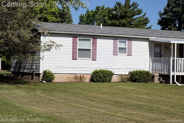 5022 Belsay Rd, Grand Blanc, MI 48439 - view of side of property with a yard