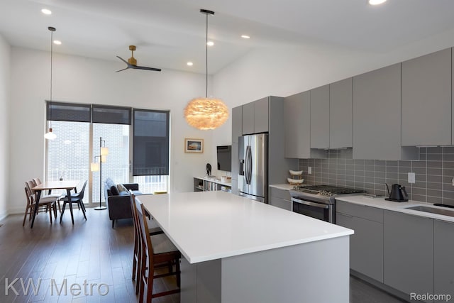 2821 Brush St, Detroit, MI 48201 - kitchen featuring gray cabinets, stainless steel appliances, modern cabinets, backsplash, and a ceiling fan