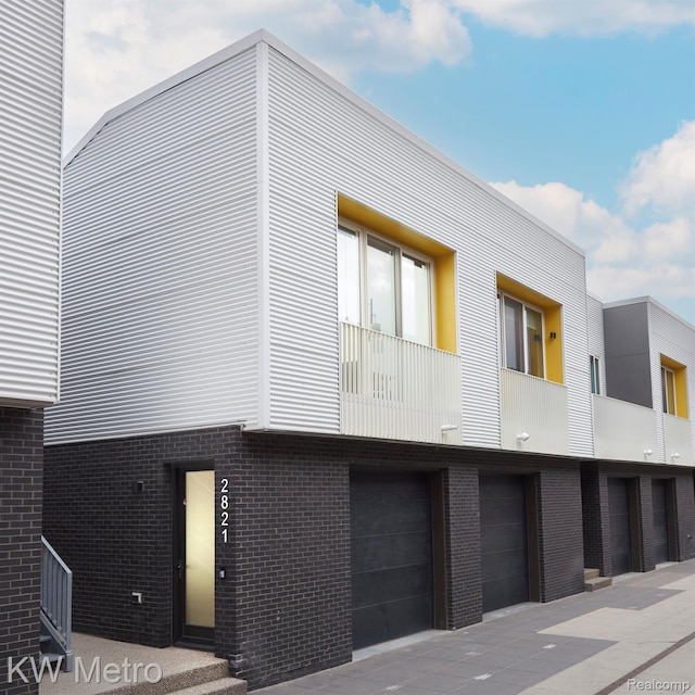 2821 Brush St, Detroit, MI 48201 - view of building exterior featuring an attached garage