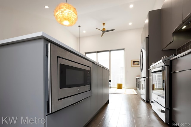 2821 Brush St, Detroit, MI 48201 - kitchen featuring modern cabinets, stainless steel appliances, recessed lighting, dark wood finished floors, and a ceiling fan