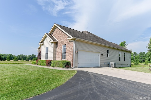 7396 Elms Rd, Swartz Creek, MI 48473 - view of property exterior with driveway, a yard, brick siding, a garage, and a shingled roof