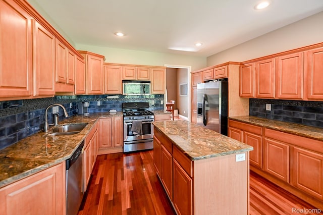 7396 Elms Rd, Swartz Creek, MI 48473 - kitchen featuring stainless steel appliances, dark wood-style flooring, dark stone counters, decorative backsplash, and recessed lighting