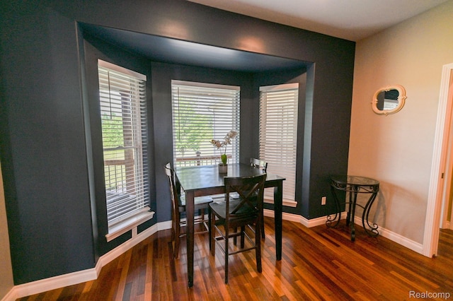 7396 Elms Rd, Swartz Creek, MI 48473 - dining room with dark wood-style floors and baseboards