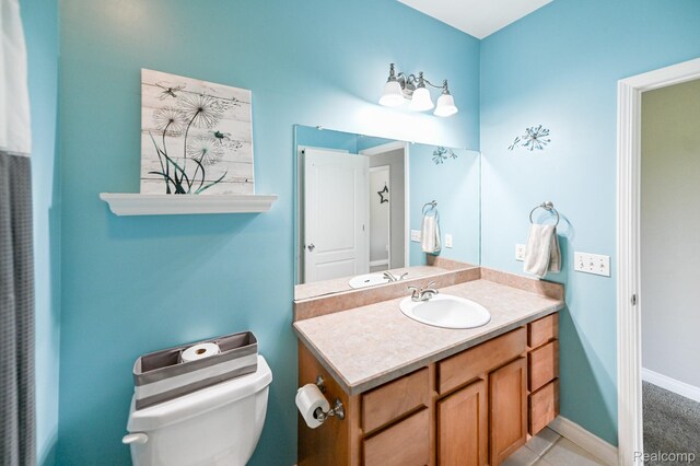 7396 Elms Rd, Swartz Creek, MI 48473 - bathroom featuring vanity and toilet