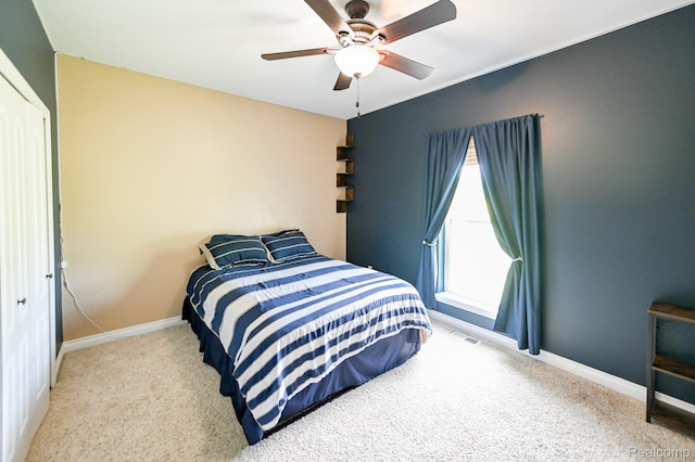 7396 Elms Rd, Swartz Creek, MI 48473 - carpeted bedroom with baseboards and a ceiling fan