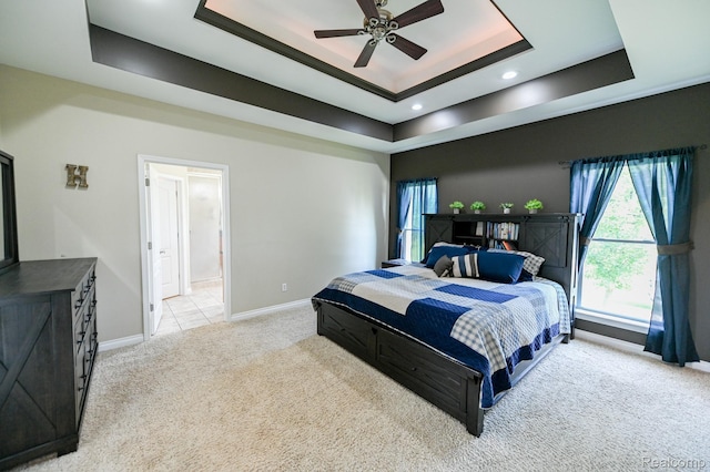 7396 Elms Rd, Swartz Creek, MI 48473 - bedroom with a tray ceiling, light colored carpet, recessed lighting, and ensuite bathroom