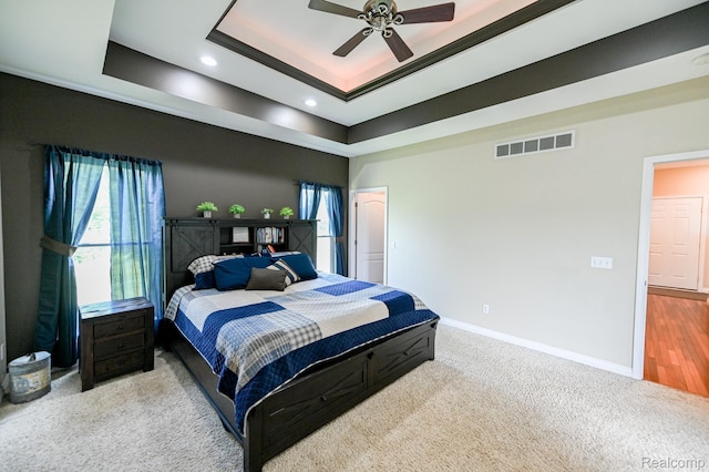 7396 Elms Rd, Swartz Creek, MI 48473 - bedroom with a tray ceiling, recessed lighting, carpet floors, and a ceiling fan