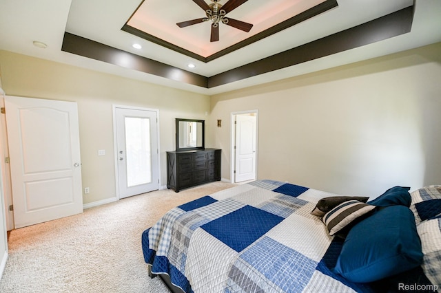 7396 Elms Rd, Swartz Creek, MI 48473 - bedroom with a tray ceiling, light colored carpet, and recessed lighting