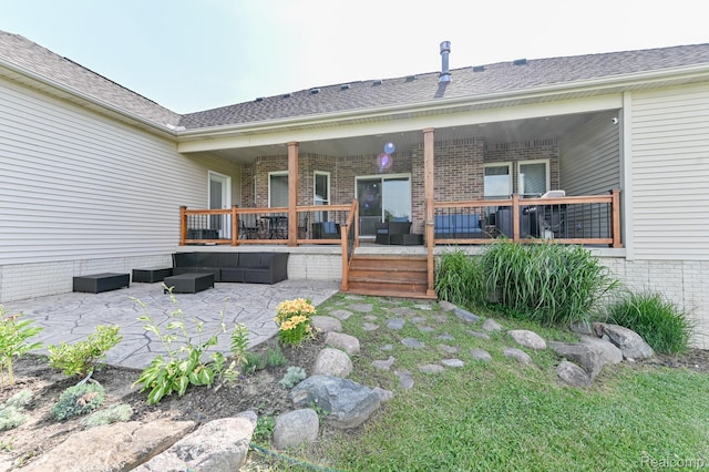 7396 Elms Rd, Swartz Creek, MI 48473 - back of property featuring an outdoor hangout area, a patio, brick siding, a deck, and roof with shingles
