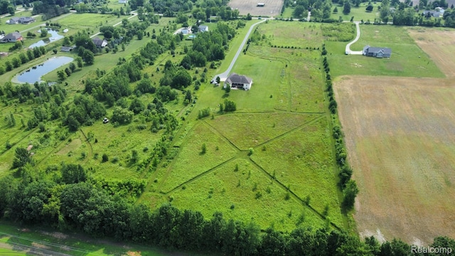 7396 Elms Rd, Swartz Creek, MI 48473 - aerial view of sparsely populated area with a large body of water