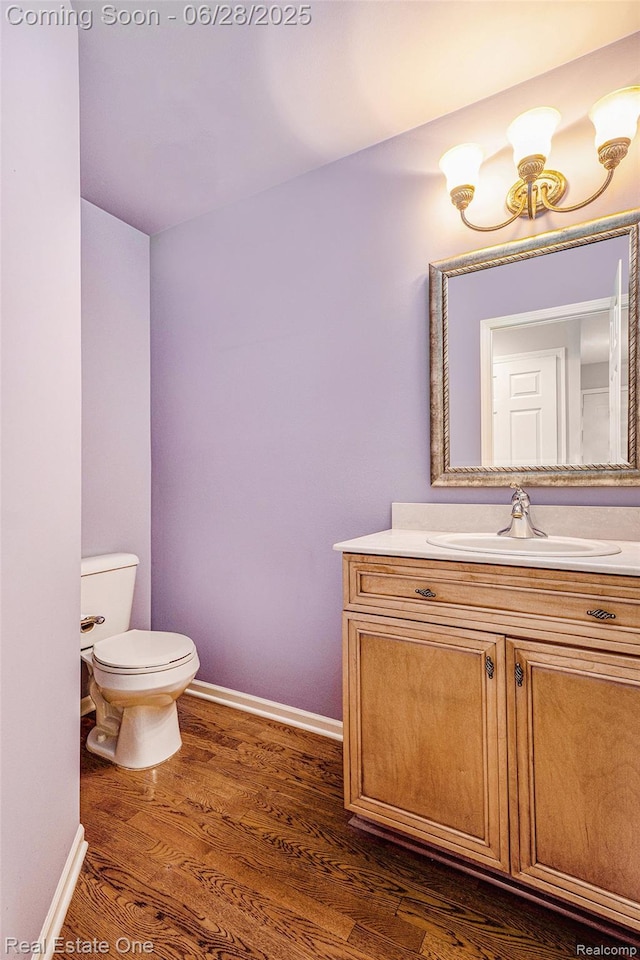 2184 Reagan Dr, Rochester Hills, MI 48309 - half bath featuring vanity and wood finished floors