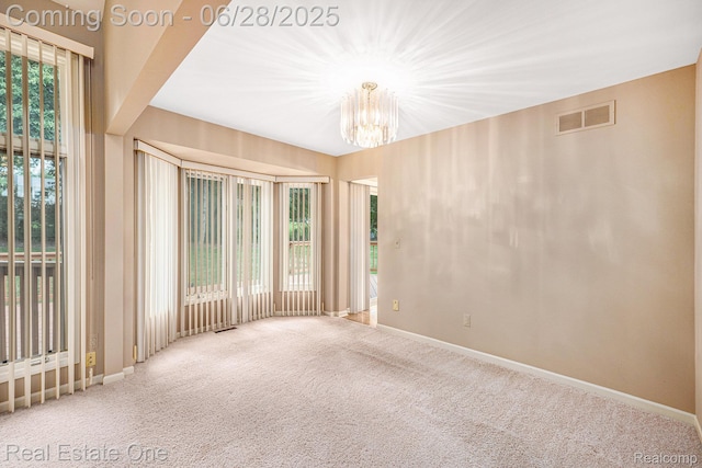 2184 Reagan Dr, Rochester Hills, MI 48309 - carpeted spare room featuring a chandelier and baseboards